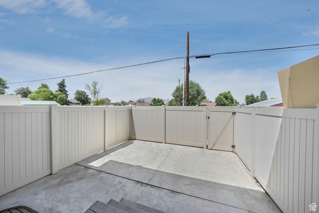 153 E Main St Unit B, Santaquin, UT 84655 - fenced backyard with a gate and a patio area