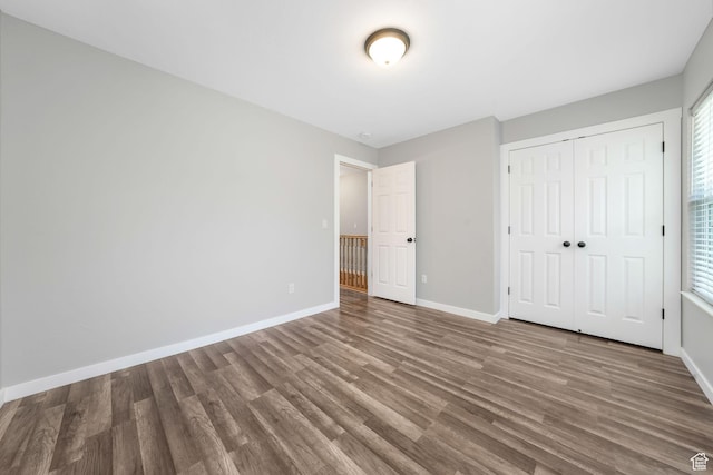 153 E Main St Unit B, Santaquin, UT 84655 - unfurnished bedroom with wood finished floors and a closet
