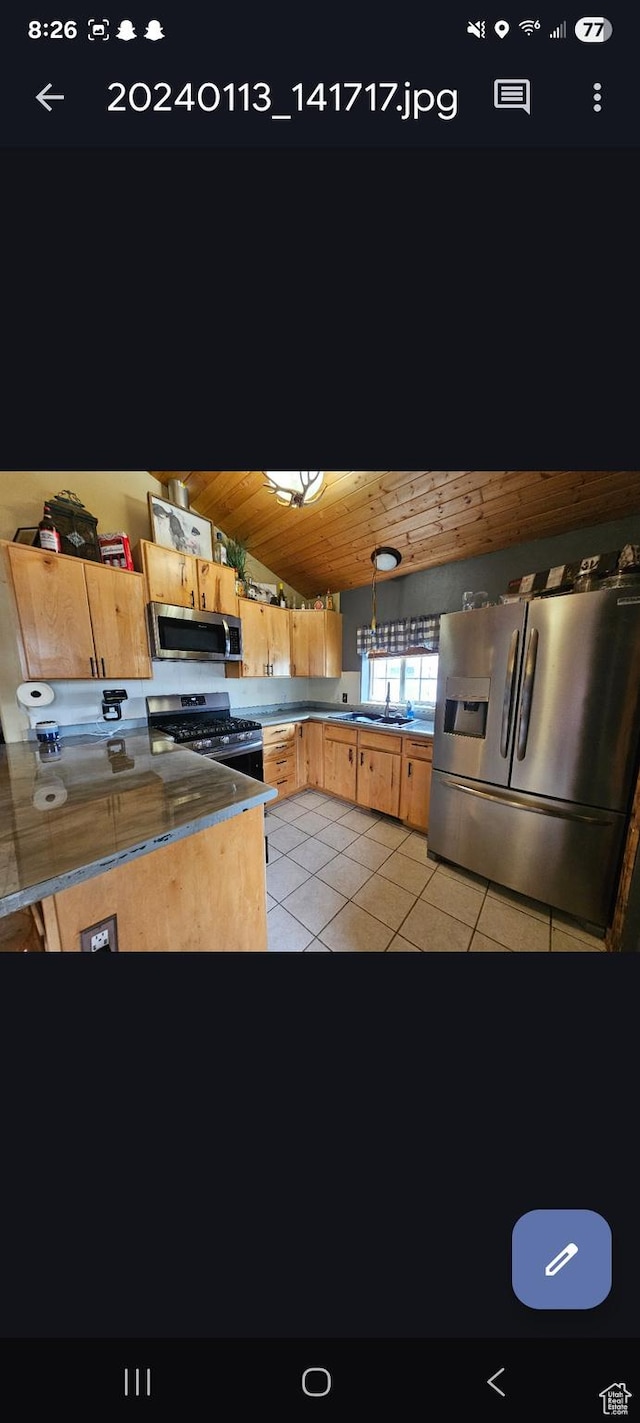 268 W Peach St, Grantsville, UT 84029 - kitchen featuring stainless steel appliances, wood ceiling, light tile patterned floors, and vaulted ceiling