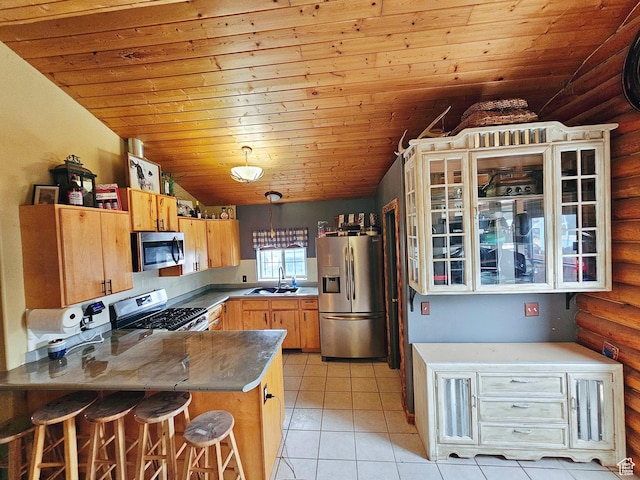 268 W Peach St, Grantsville, UT 84029 - kitchen with appliances with stainless steel finishes, wood ceiling, a peninsula, log walls, and lofted ceiling