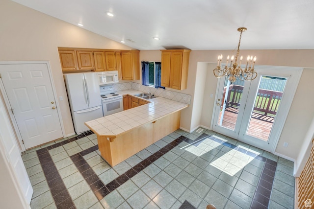 2086 N 1100 E, Lehi, UT 84043 - kitchen with white appliances, inlaid floor details, a peninsula, a chandelier, and tile countertops
