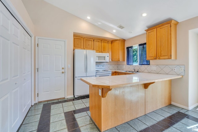 2086 N 1100 E, Lehi, UT 84043 - kitchen featuring white appliances, a peninsula, tasteful backsplash, vaulted ceiling, and a kitchen bar