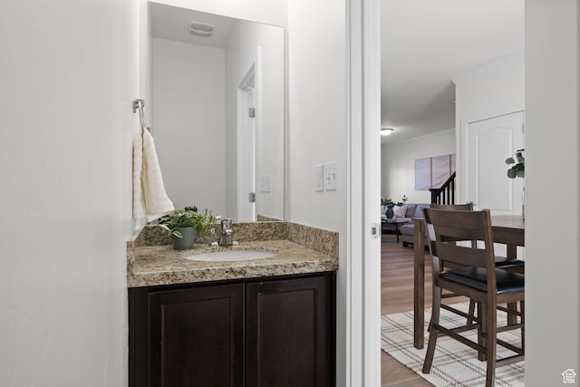 13574 S Cantania Way, Draper, UT 84020 - bathroom with wood finished floors, vanity, and crown molding