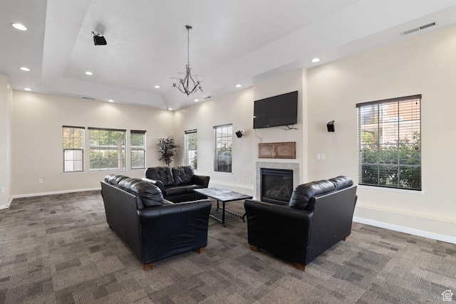 13574 S Cantania Way, Draper, UT 84020 - living area with recessed lighting, dark colored carpet, a tiled fireplace, a chandelier, and a tray ceiling