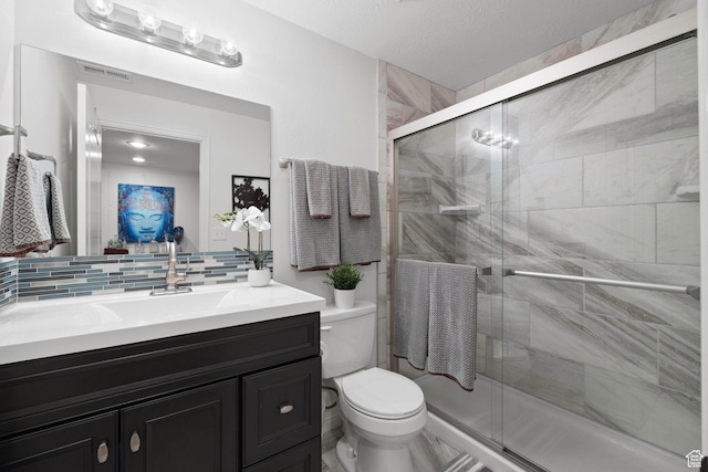 13574 S Cantania Way, Draper, UT 84020 - bathroom with vanity, a shower stall, and tasteful backsplash
