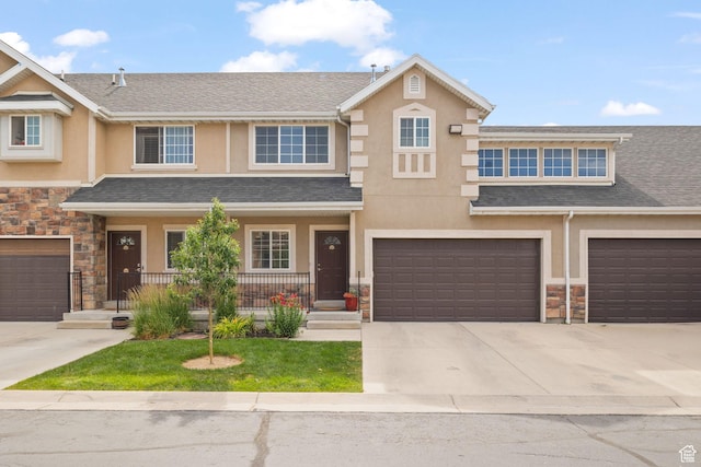 13574 S Cantania Way, Draper, UT 84020 - view of property with stucco siding, driveway, stone siding, and an attached garage