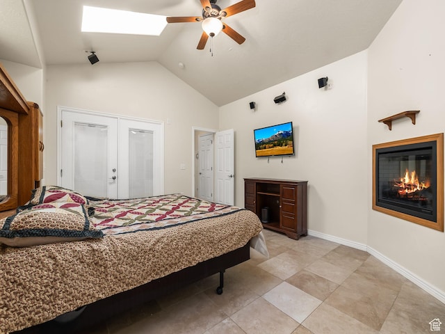 550 S 700 W, Payson, UT 84651 - bedroom with a glass covered fireplace, french doors, a skylight, high vaulted ceiling, and a ceiling fan