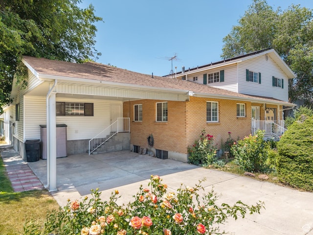 550 S 700 W, Payson, UT 84651 - back of house with brick siding, a carport, a shingled roof, and driveway