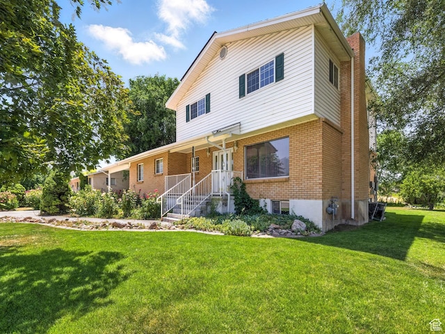 550 S 700 W, Payson, UT 84651 - view of front of property with a chimney, brick siding, and a front yard