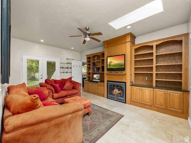 550 S 700 W, Payson, UT 84651 - living room with a ceiling fan, a large fireplace, recessed lighting, french doors, and a skylight