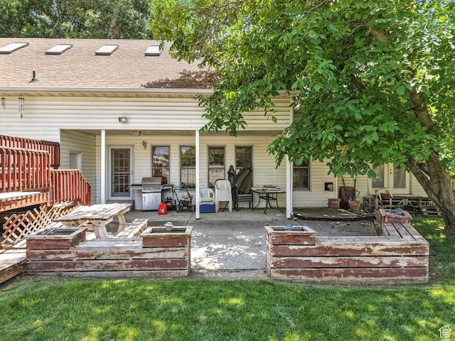 550 S 700 W, Payson, UT 84651 - back of property featuring a wooden deck, roof with shingles, and a patio area