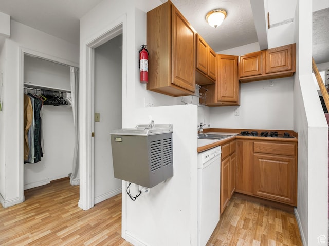 550 S 700 W, Payson, UT 84651 - kitchen with dishwasher, light wood-style flooring, black gas stovetop, and brown cabinets