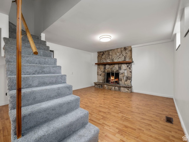 550 S 700 W, Payson, UT 84651 - living room featuring stairway, wood finished floors, and a stone fireplace