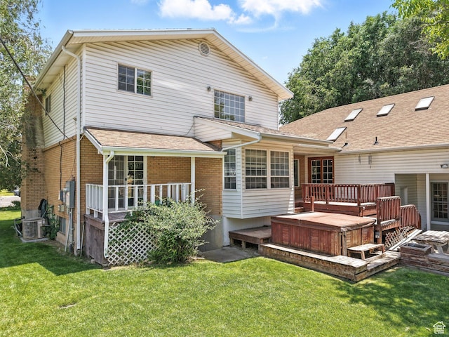 550 S 700 W, Payson, UT 84651 - back of house with a hot tub, a deck, a yard, and brick siding