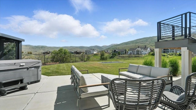 3224 Farm Ridge Ct, Mountain Green, UT 84050 - view of patio / terrace with a mountain view, a hot tub, and an outdoor hangout area