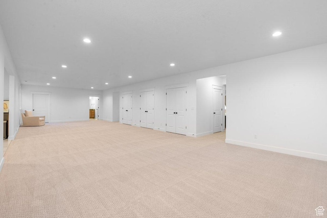 11449 S Bingham Rim Rd, South Jordan, UT 84009 - unfurnished living room with recessed lighting and light carpet