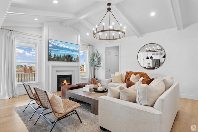 11449 S Bingham Rim Rd, South Jordan, UT 84009 - living area with a chandelier, light wood-style floors, a glass covered fireplace, and recessed lighting