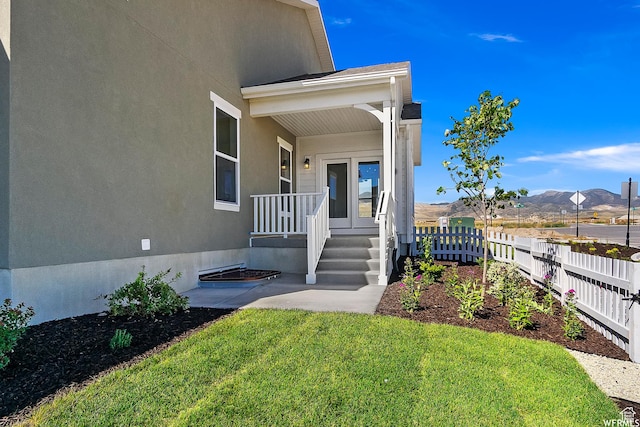 11449 S Bingham Rim Rd, South Jordan, UT 84009 - view of exterior entry with a mountain view and stucco siding