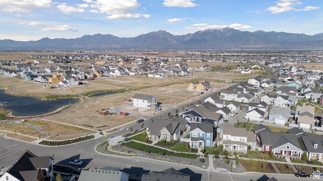 11449 S Bingham Rim Rd, South Jordan, UT 84009 - aerial overview of property's location with nearby suburban area and a water and mountain view