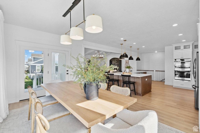11449 S Bingham Rim Rd, South Jordan, UT 84009 - dining space with light wood-type flooring and recessed lighting