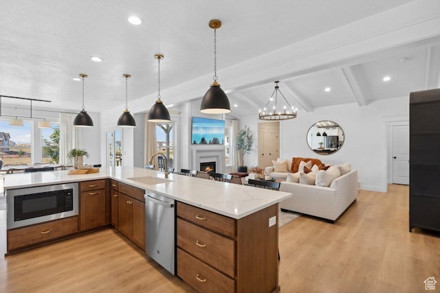 11449 S Bingham Rim Rd, South Jordan, UT 84009 - kitchen featuring stainless steel appliances, open floor plan, light wood-style flooring, and recessed lighting