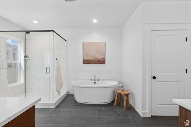11449 S Bingham Rim Rd, South Jordan, UT 84009 - bathroom with vanity, a freestanding bath, a shower stall, tile patterned floors, and a wainscoted wall