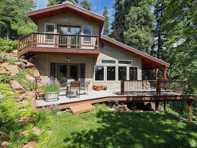 2137 N Pinecrest Canyon Rd Unit 35, Emigration Canyon, UT 84108 - rear view of house with a wooden deck, stucco siding, and a yard