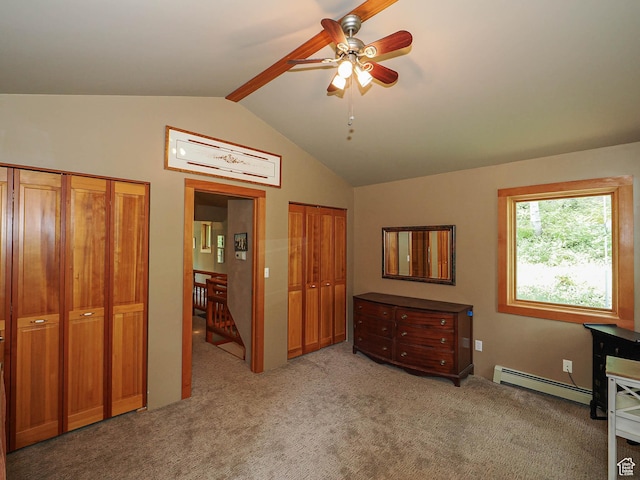 2137 N Pinecrest Canyon Rd Unit 35, Emigration Canyon, UT 84108 - bedroom with baseboard heating, two closets, light colored carpet, lofted ceiling, and ceiling fan