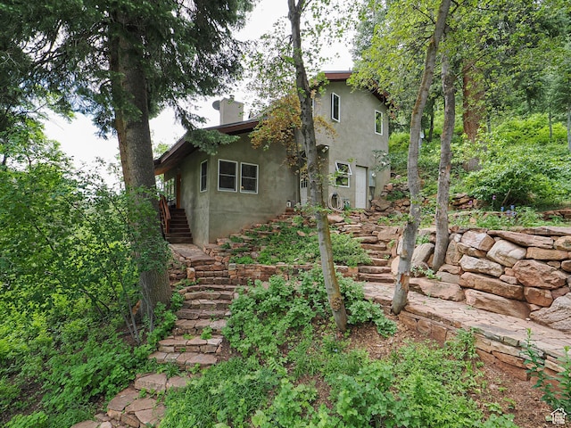 2137 N Pinecrest Canyon Rd Unit 35, Emigration Canyon, UT 84108 - rear view of property with stairway and stucco siding