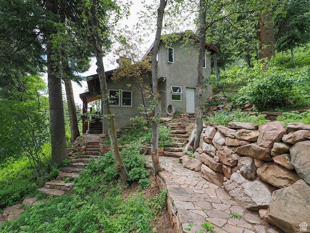 2137 N Pinecrest Canyon Rd Unit 35, Emigration Canyon, UT 84108 - back of property featuring stairs and stucco siding