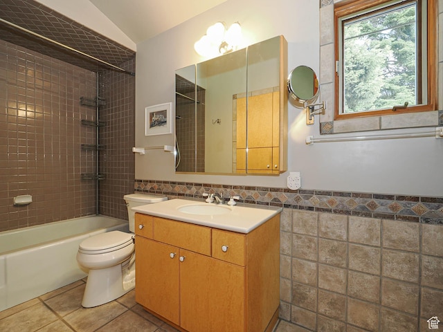 2137 N Pinecrest Canyon Rd Unit 35, Emigration Canyon, UT 84108 - bathroom featuring tile walls, vanity, shower / tub combination, tile patterned floors, and a wainscoted wall