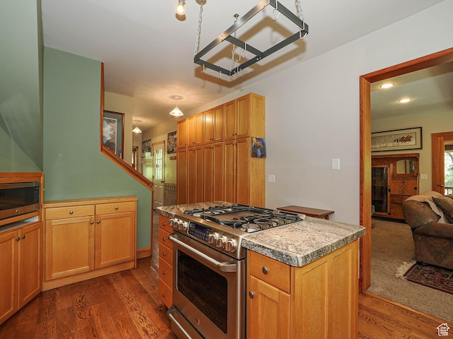 2137 N Pinecrest Canyon Rd Unit 35, Emigration Canyon, UT 84108 - kitchen with stainless steel appliances, dark wood finished floors, a chandelier, a center island, and open floor plan