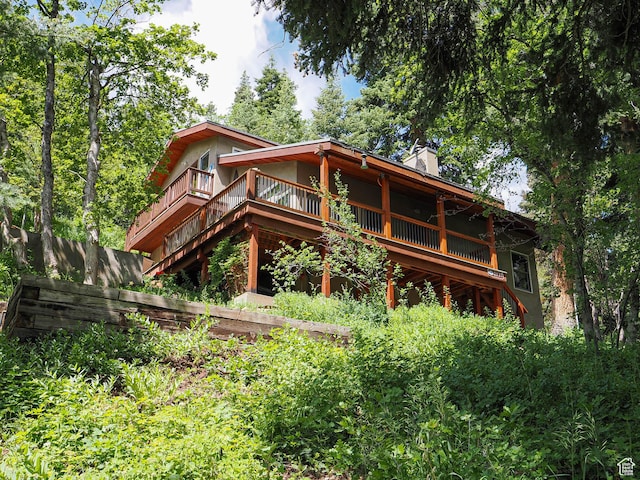 2137 N Pinecrest Canyon Rd Unit 35, Emigration Canyon, UT 84108 - back of house featuring a chimney and a deck