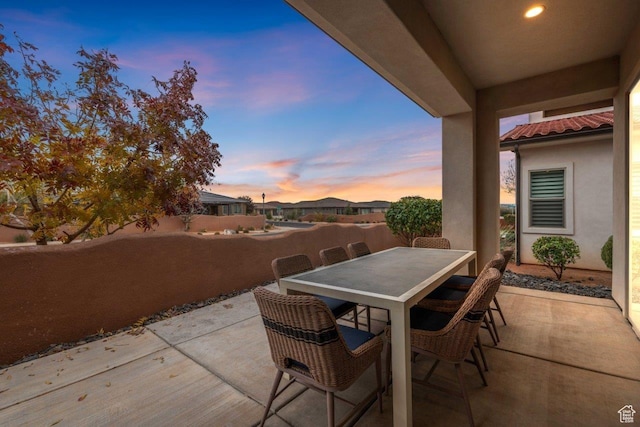 3780 W Arcadia Dr Unit 25, Santa Clara, UT 84765 - patio terrace at dusk with a patio and outdoor dining space
