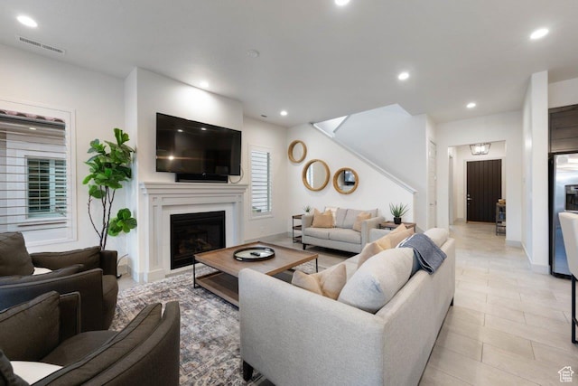 3780 W Arcadia Dr Unit 25, Santa Clara, UT 84765 - living area featuring recessed lighting, a glass covered fireplace, and light tile patterned floors