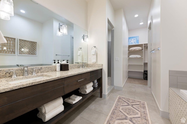 3780 W Arcadia Dr Unit 25, Santa Clara, UT 84765 - full bath featuring double vanity, tile patterned floors, a spacious closet, a tile shower, and recessed lighting