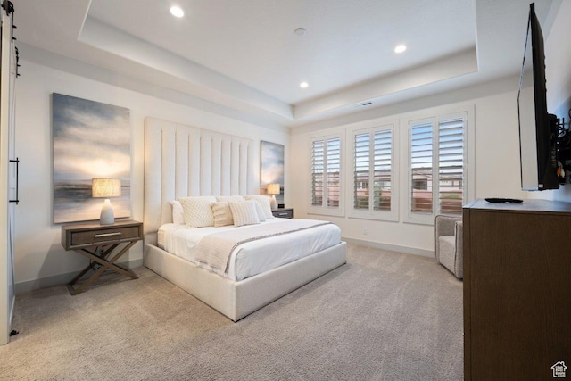 3780 W Arcadia Dr Unit 25, Santa Clara, UT 84765 - bedroom with a tray ceiling, light carpet, recessed lighting, and a barn door