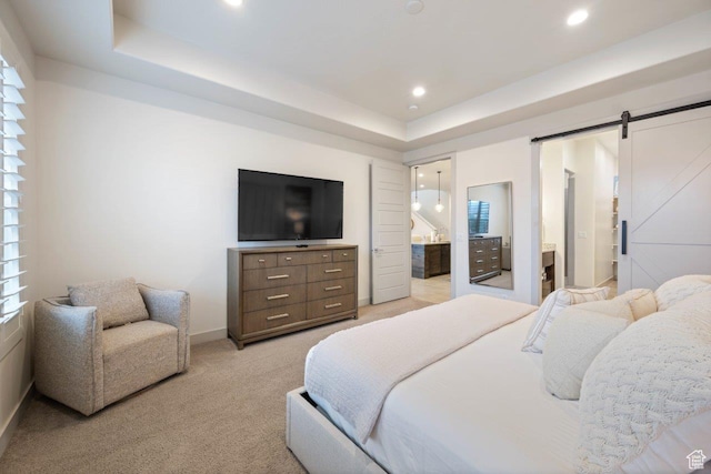 3780 W Arcadia Dr Unit 25, Santa Clara, UT 84765 - bedroom featuring light carpet, a tray ceiling, ensuite bathroom, a barn door, and recessed lighting