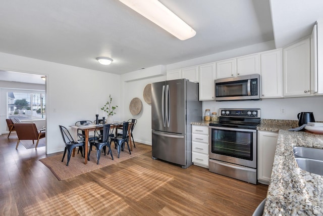 1747 S 750 E, Orem, UT 84097 - kitchen featuring stainless steel appliances, wood finished floors, white cabinets, and light stone countertops