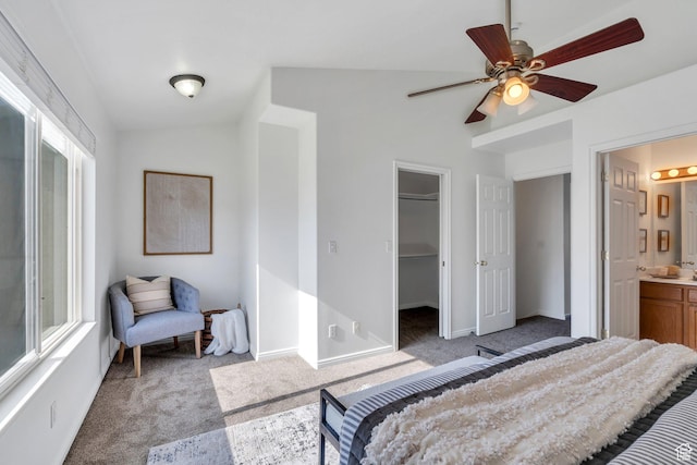 1747 S 750 E, Orem, UT 84097 - bedroom featuring light colored carpet, lofted ceiling, a walk in closet, connected bathroom, and multiple windows