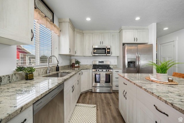 893 N 300 W, Santaquin, UT 84655 - kitchen featuring stainless steel appliances, dark wood-style flooring, light stone counters, recessed lighting, and a textured ceiling