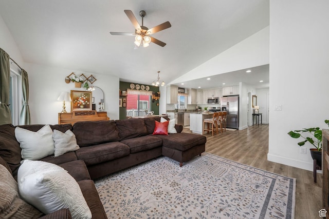 893 N 300 W, Santaquin, UT 84655 - living room with ceiling fan, light wood-style floors, high vaulted ceiling, and a chandelier