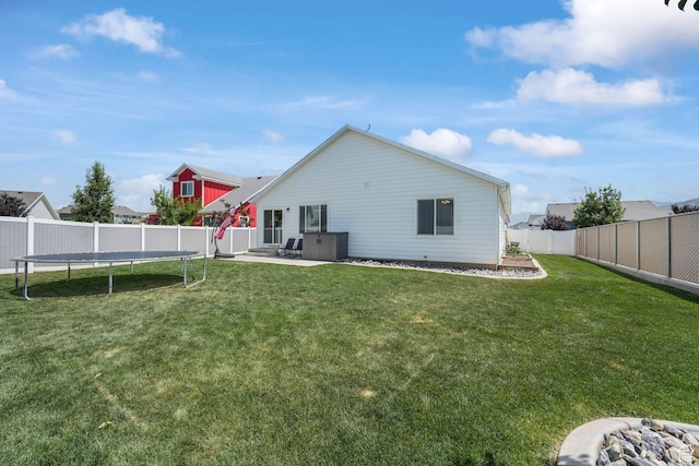 893 N 300 W, Santaquin, UT 84655 - back of property with a trampoline, a fenced backyard, and a patio area