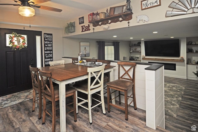 2857 W 2250 N, Clinton, UT 84015 - dining area featuring wood finished floors, ceiling fan, bar area, and recessed lighting
