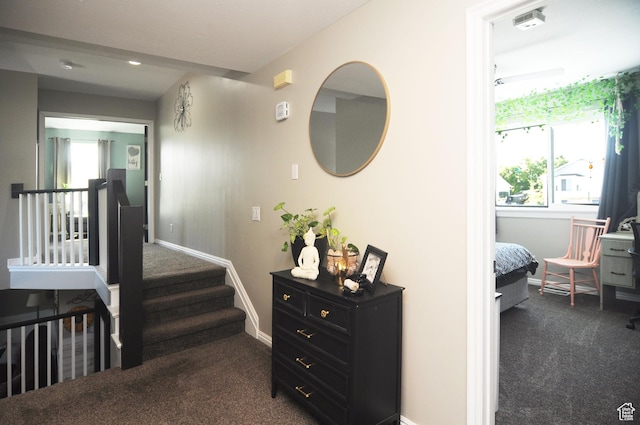 2857 W 2250 N, Clinton, UT 84015 - hallway with dark colored carpet, plenty of natural light, and stairs