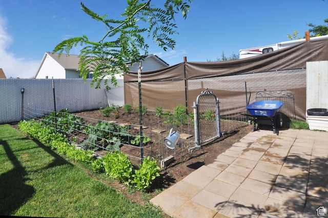 2857 W 2250 N, Clinton, UT 84015 - fenced backyard featuring a garden