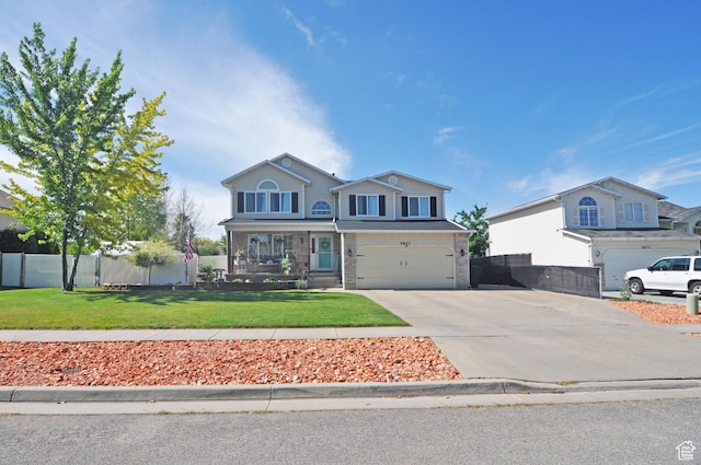 2857 W 2250 N, Clinton, UT 84015 - view of front of house with concrete driveway and an attached garage