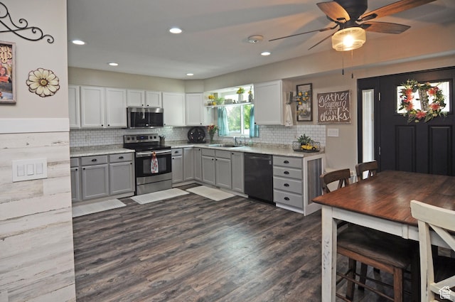 2857 W 2250 N, Clinton, UT 84015 - kitchen with stainless steel appliances, gray cabinets, a ceiling fan, dark wood-style floors, and tasteful backsplash