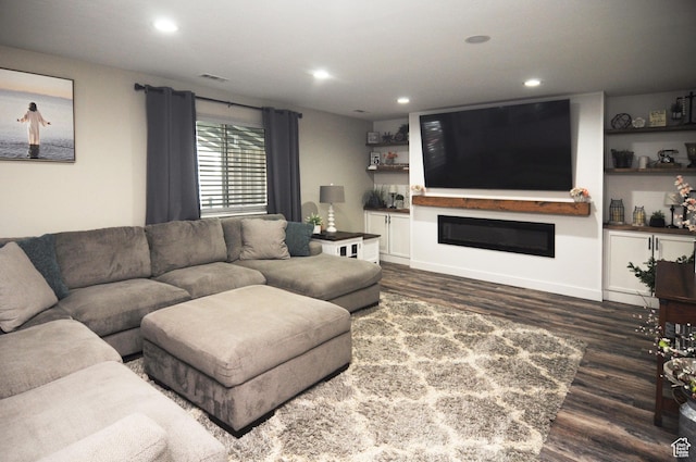 2857 W 2250 N, Clinton, UT 84015 - living room featuring dark wood-style flooring, a glass covered fireplace, and recessed lighting