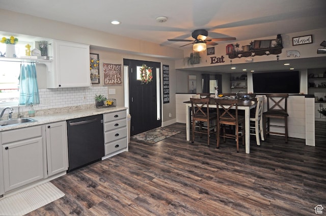 2857 W 2250 N, Clinton, UT 84015 - kitchen featuring dishwasher, ceiling fan, dark wood-style floors, decorative backsplash, and white cabinetry